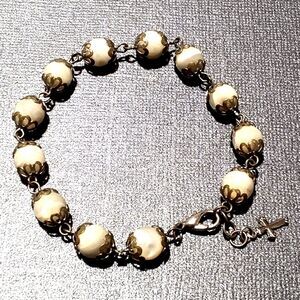 Vintage Mother of Pearl Beaded Bracelet with Gold Tone Cross Charm 7.75"